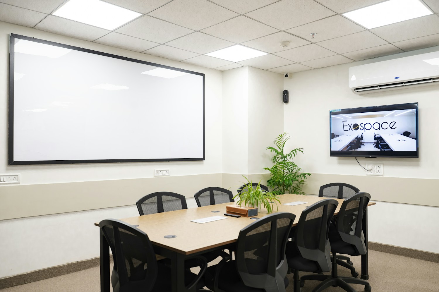 Illustrative office meeting room with tables, chairs and glass walls